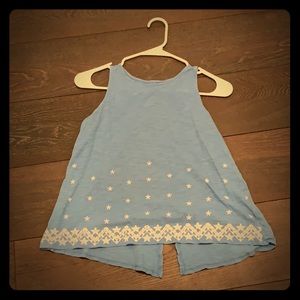 Blue tank top with white stars on bottom